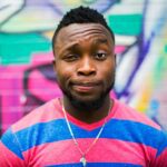 black haired man making face